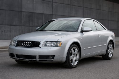 Silver Audi coupe parked on a street